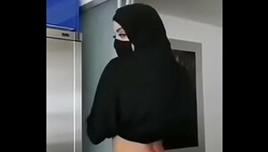 Busty hottie in hijab strips