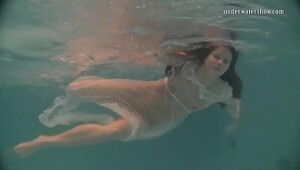 White moth in a sundress underwater