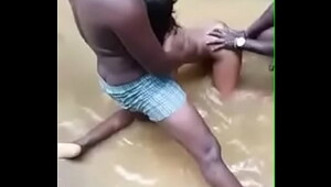 2  men fucking her in a river