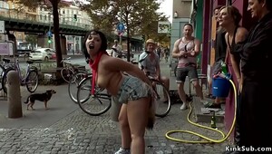 Chesty Euro babe butt plugged in public