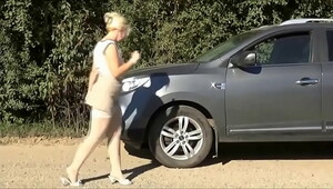 Sexy blonde and her car